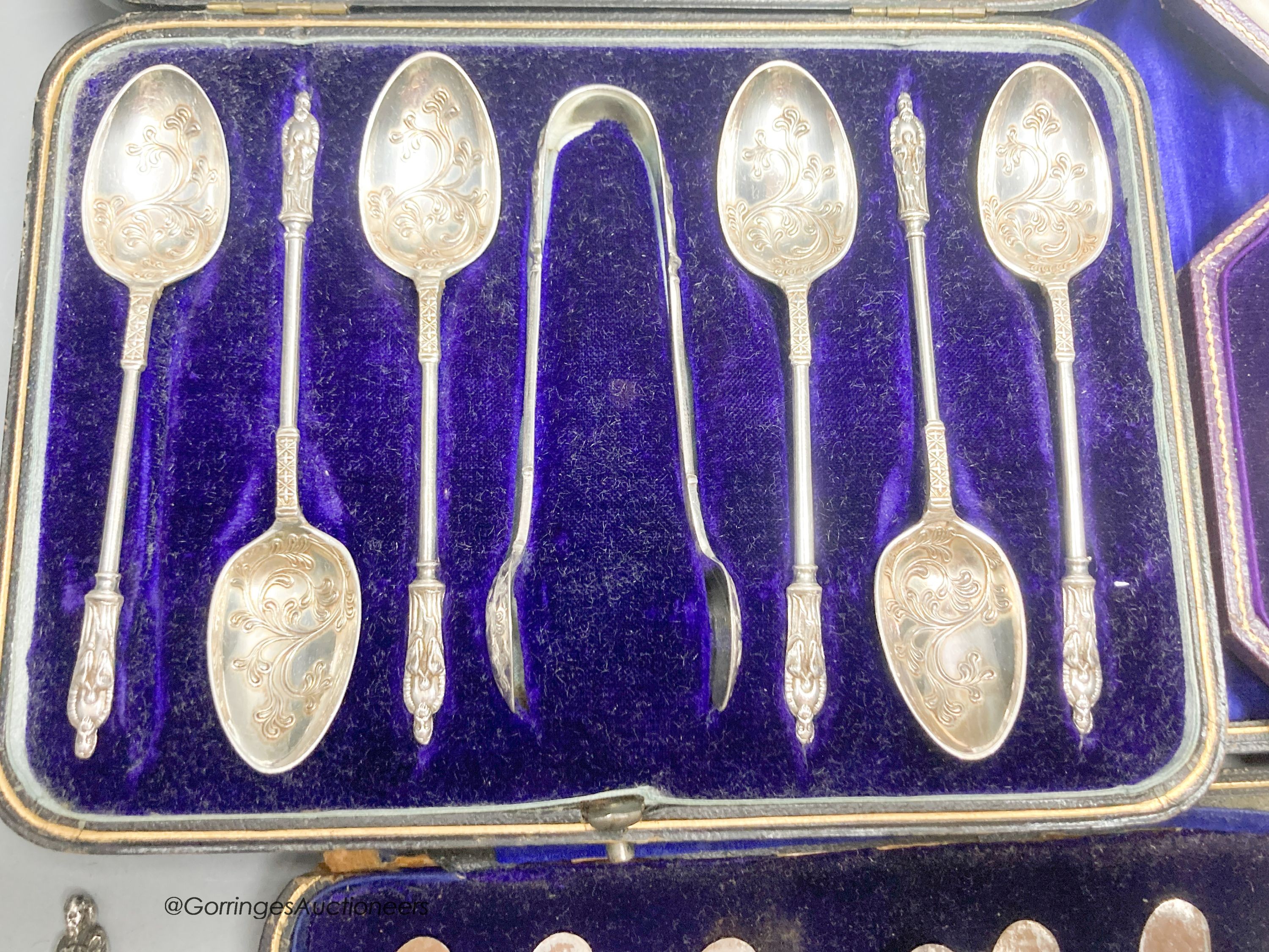 A pair of late Victorian silver apostle serving spoons, William Hutton & Sons Ltd, London, 1895, 20.4cm and three cased sets, including christening set, cake knives and plated apostle spoons